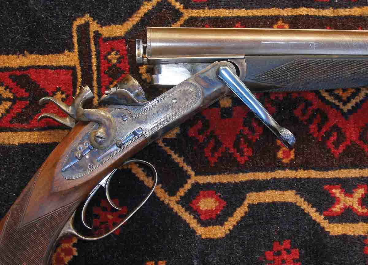 Bolsters are visible on the breech face and a lug extension further ensures a secure lock-up. The barrels are pushed forward by the cammed leverwork. To use Diggory Hadoke’s phrase, the gun has been “tarted up” and the lever ought not to have been blued.